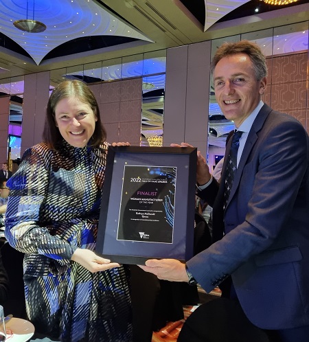 Kathryn McDonald with her Finalist award being congratulated by Andrew Lake, Gen Manager Operations at Qenos